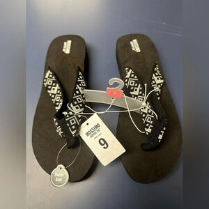 Black Womens flip flops with cushion material and silver design